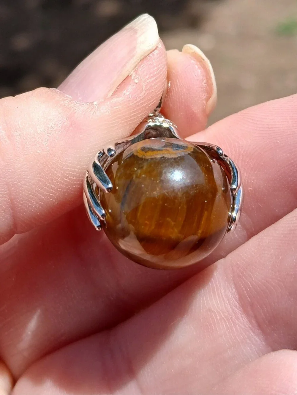 New 18K Hands Holding Tiger Eye Sphere Pendant.